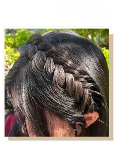 Detailed view of dark brown fishtail braided headband with natural hair texture