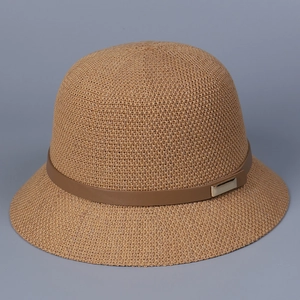 Detail of camel knit sun hat featuring a brown leather band and gold buckle accent