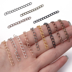 Adjustable metal extension chains for jewelry in various colors shown on a hand