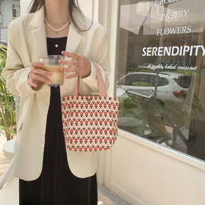 Corduroy tote bag featuring a red tulip floral print and pink webbing handles for daily use