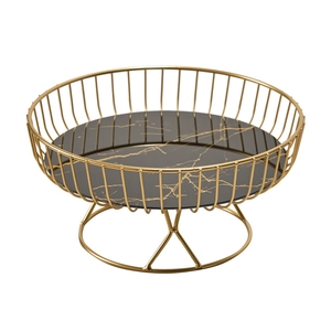 Nordic gold metal fruit tray with round black marble pattern base on white background