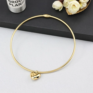 Minimalist gold magnetic heart choker necklace featuring a sleek polished snake chain finish