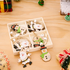 Festive Christmas wooden ornaments set featuring Santa and snowman in a gift box