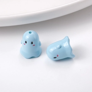 Close-up of light blue cartoon ghost acrylic beads with pink blush and top holes