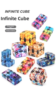 Macro shot showing 9 colorful galaxy and marble patterned infinite cubes for stress relief