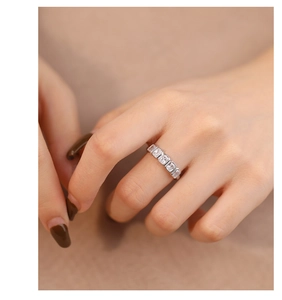 Detailed view of sterling silver ring featuring square-cut sparkling zirconia stones