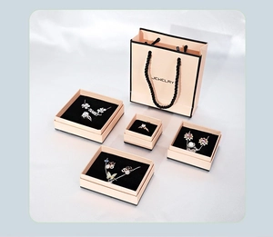 Pink jewelry gift boxes for necklaces, rings, and earrings with matching carry bags
