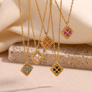 Detail of 18K gold plated rhombus pendants set with four colorful zircon crystals