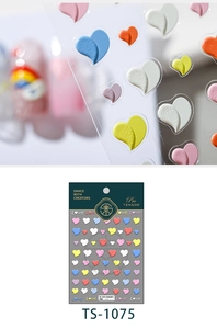 Macro shot of 3D embossed heart nail stickers with rainbow peach pattern on TS-1075 card