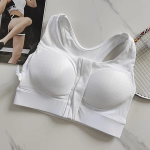 Detailed close-up of white front zipper sports bra with breathable mesh and wide straps
