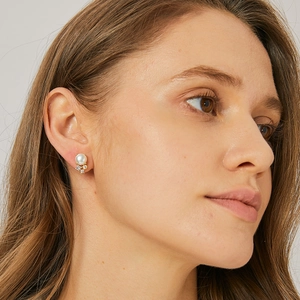Elegant shell pearl earrings with zircon accents on gold plated silver stud