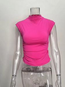 Close-up of ruched side details and elastic fabric on this slim fit rose red halter top
