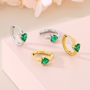 Fashionable stainless steel heart earrings with emerald green stones in gold and silver