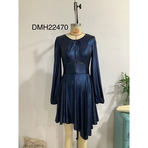 Close-up of ruched detail and metallic finish on this navy blue long sleeve party dress