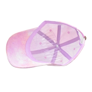 Internal detail of tie-dye baseball cap showing purple lining and metal buckle