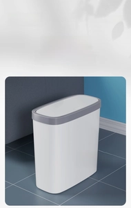 Modern white slim trash can with a press-top lid and gray rim for narrow bathroom spaces