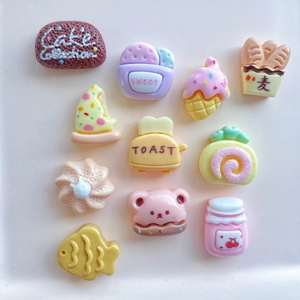 Miniature resin food charms including toasted bread and bear cookies for DIY crafts