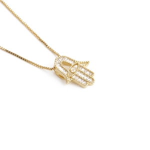 Golden Hamsa pendant necklace with clear crystals on a delicate box chain for women