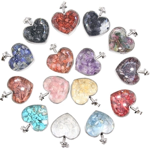 Collection of heart-shaped natural crystal stone pendants with silver metal edges on white
