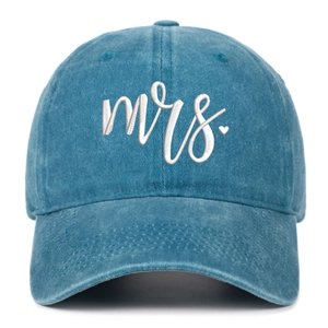 Close-up of white Mrs. embroidery and heart on washed blue denim baseball cap