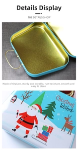 Blue Christmas tin box with gold handle showing metal interior and festive cover prints