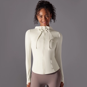 Detail of white athletic jacket showing zip closure hood and thumbhole cuff sleeves