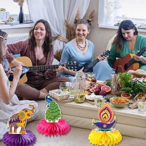 Diwali honeycomb centerpieces with elephant, peacock, and oil lamp patterns for party decor