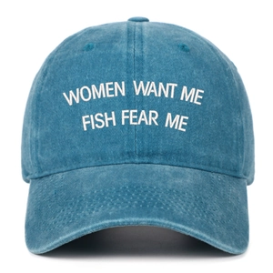 Close-up of Women Want Me Fish Fear Me embroidered text on blue washed baseball cap