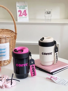 Detail view of portable matte coffee mugs with carrying straps and leak-proof lids