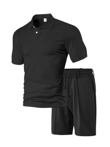 Detail of black waffle knit polo shirt and shorts set featuring premium fabric texture