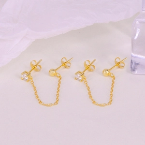 Detailed view of gold 925 silver tassel ear chains with micro-set cubic zirconia crystals