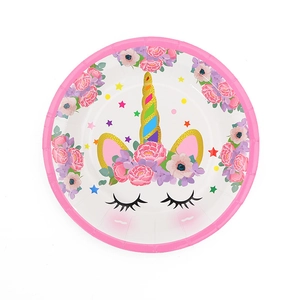 Close-up of disposable paper plate with unicorn and floral design for themed party