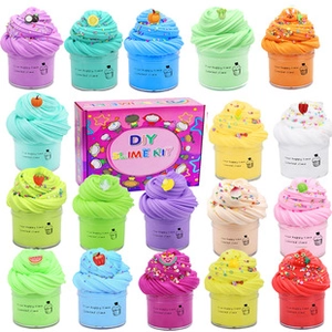 Macro shot of colorful scented DIY slime jars with fruit charms and gift box packaging