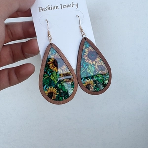 Ethnic teardrop earrings with sunflower pattern and wooden frame held on card