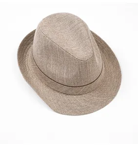 Detail showing the mixed-color woven texture and decorative band of the fedora sun hat