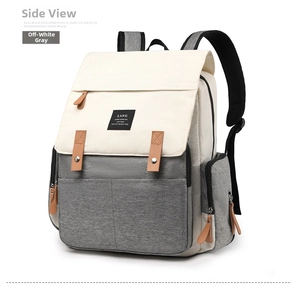 Detailed side view of LAND beige and grey diaper backpack with brown leather zip pulls