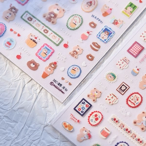 Close-up of MC-25 thin nail art stickers featuring cute bears and dessert illustrations
