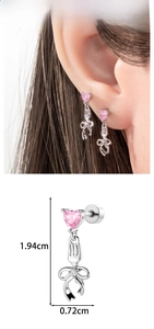 Detail view of heart zircon and fork bow stud earrings with 1.94cm size marking