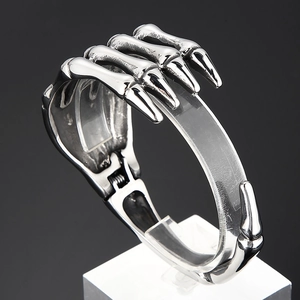 Detail view of gothic skull hand claw bracelet with retro silver finish and hinged joint