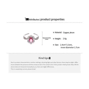 Detail view of oval pink zircon ring in silver finish with white cubic zirconia accents