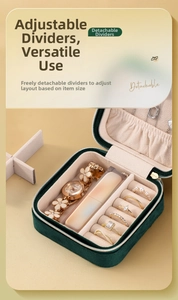 Detail view of the velvet jewelry box showing detachable dividers and ring slots