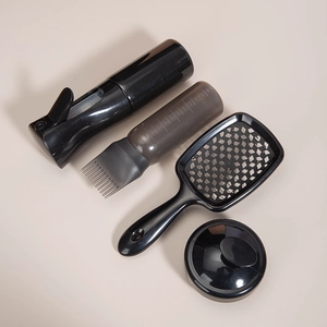 Detailed set of black hair styling tools including spray bottle and comb with scale marks