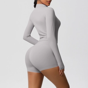 Detail of light gray long-sleeved zipper top and high-waist shorts yoga fitness set
