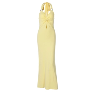 Detail of sexy yellow halter neck maxi dress featuring twist knot and cut-out waist design