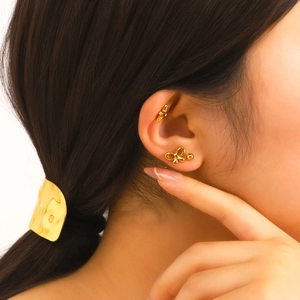 18K gold plated bow and star stud earrings set worn by a model for a vintage look