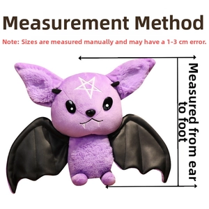 Detail of purple bat plush with white star embroidery and black leather-like wings