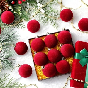 9-piece set of red flocked Christmas ball ornaments in a gift box with festive greenery