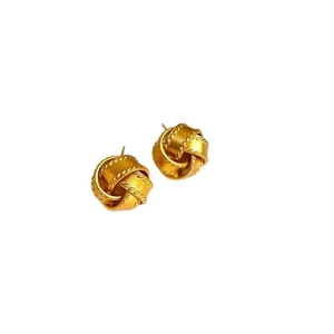 Elegant gold knot stud earrings with woven metallic texture and polished finish on white background
