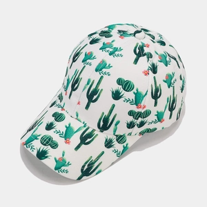 Close-up of tropical green cactus pattern on breathable white cotton baseball cap