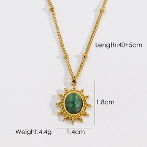 Detail of 14K gold stainless steel necklace with green oval stone and sunburst pendant